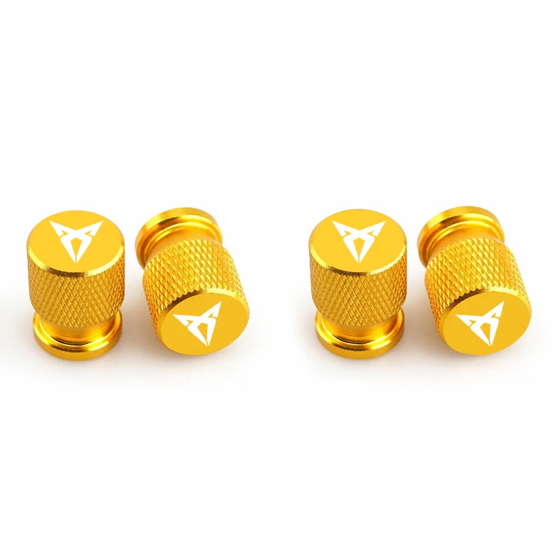 Bouchons de valve Cupra, de couleur jaune avec logo Cupra inscrit sur les bouchons de valve.