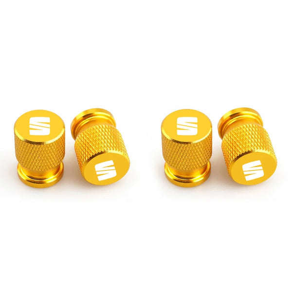 Bouchon de valve Seat avec partie granulé et logo Seat sur le bouchon, de couleur jaune.