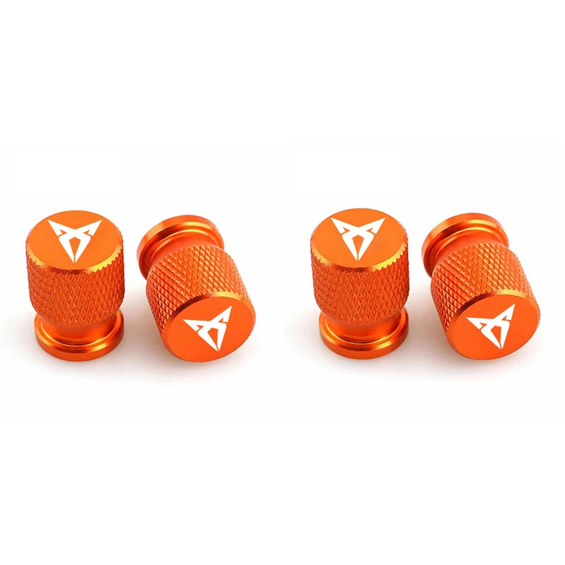 Bouchons de valve Cupra, de couleur orange avec logo Cupra inscrit sur les bouchons de valve.