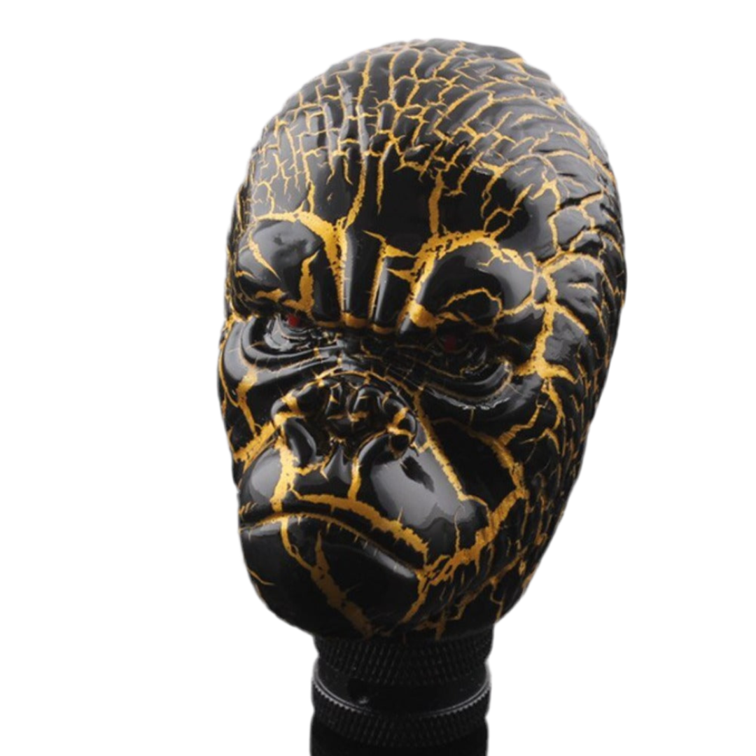 Pommeau de vitesse en forme de tête de singe.