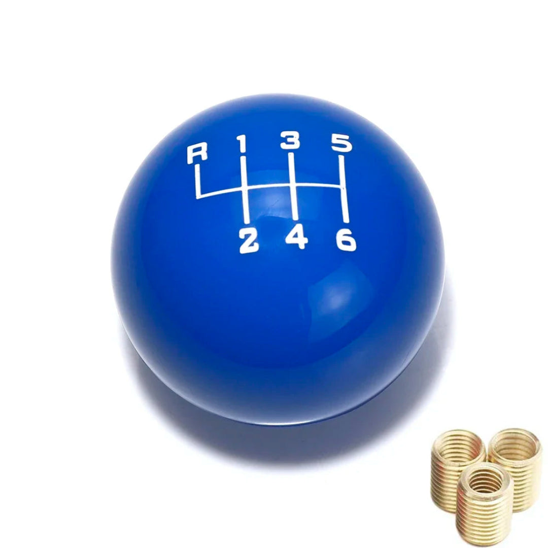 Pommeau de vitesse universel boîte 6 bleu forme ronde avec gravure des rapports de couleur blanc.