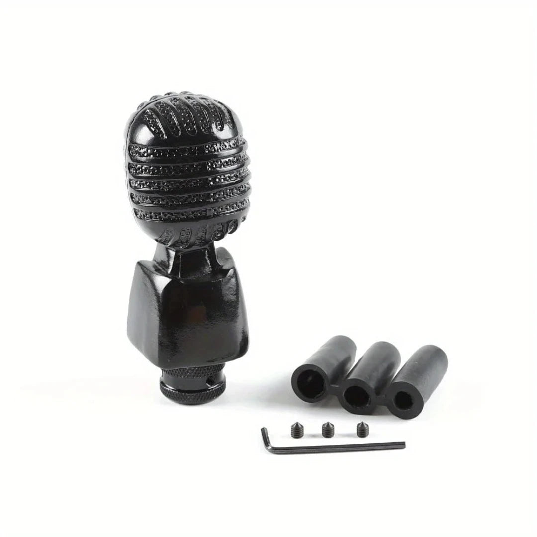 Pommeau de vitesse original en forme de microphone, de couleur noir.
