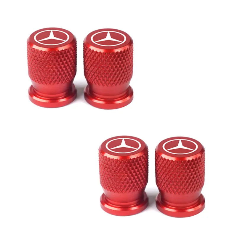 Bouchon de valve Mercedes de couleur rouge, avec le logo Mercedes présent sur le haut du bouchon.