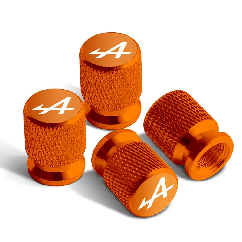 Bouchons de valves pneu voiture Renault Alpine de couleur orange, avec le logo Alpine sur le bouchon.