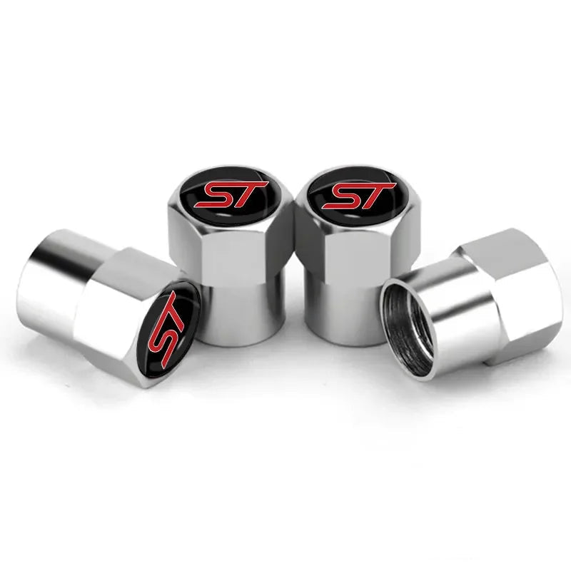 Bouchon de valve Ford ST, avec logo ST inscrit sur le dessus, de couleur gris.