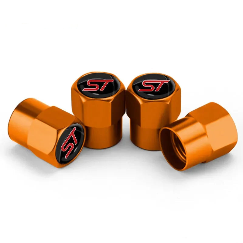 Bouchon de valve Ford ST, avec logo ST inscrit sur le dessus, de couleur orange.