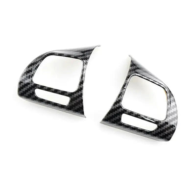 Les deux coques aspect carbone pour les commandes au volant gauche et droite de Golf 6