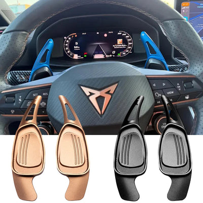 Extensions de palette montées sur le volant d'une Cupra Formentor, avec les finitions bronze cuivré et noire au premier plan