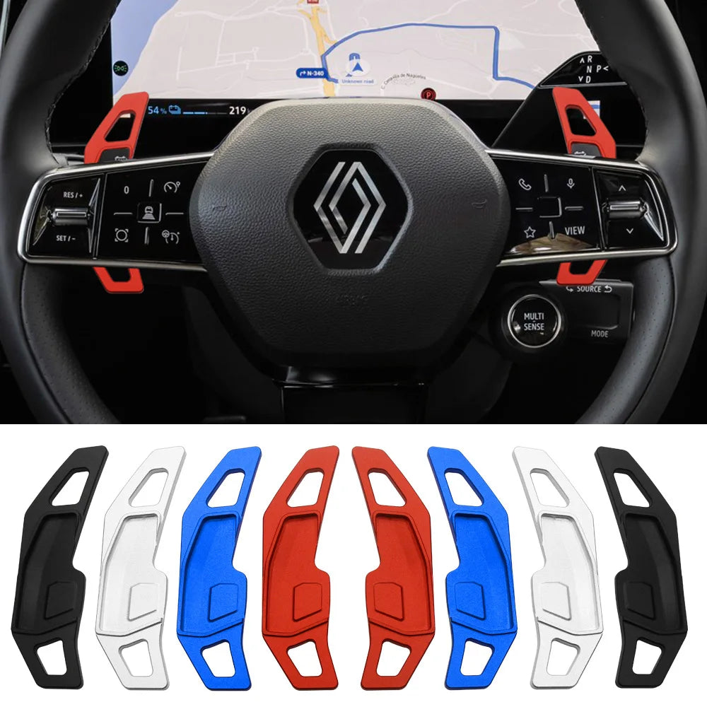 Extensions de palette montées sur le volant d'une Renault Rafale, avec les quatre coloris disponibles alignés en dessous