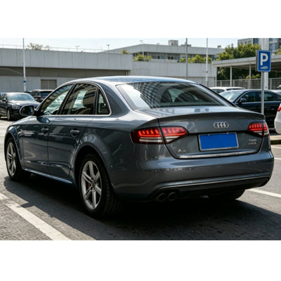 Audi A4 B8 berline grise équipée des feux arrière LED fumés