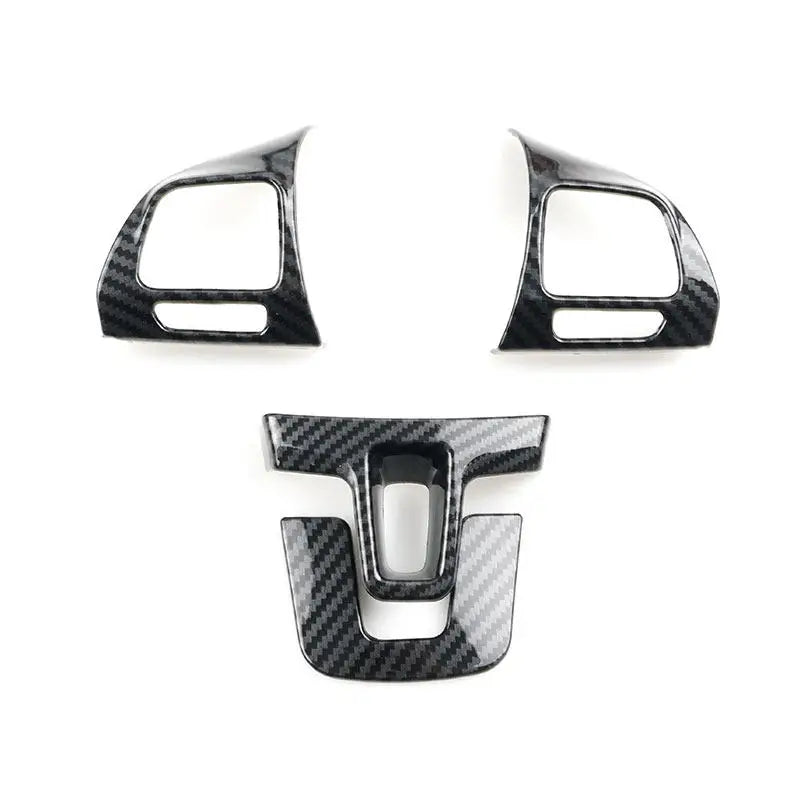 Les quatre pièces aspect carbone pour les branches latérales et basse du volant de Golf 6