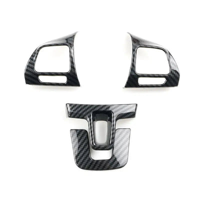 Les quatre pièces aspect carbone pour les branches latérales et basse du volant de Golf 6