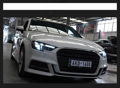 Audi A3 8V blanche équipée des phares LED, feux de jour allumés