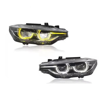 Deux phares LED BMW F30 côte à côte, anneaux jaunes et anneaux blancs