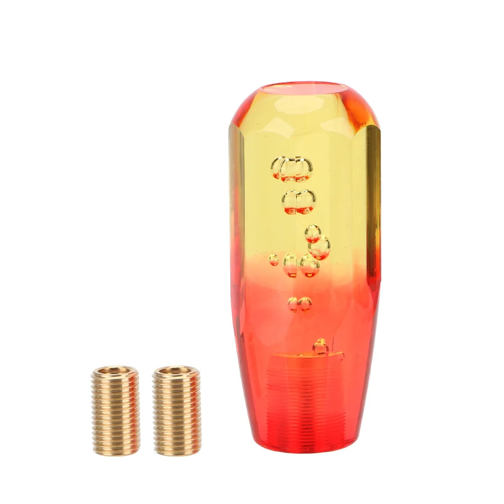 Pommeau de vitesse original jaune et rouge 10 cm en acrylique transparent avec bulles d’air.