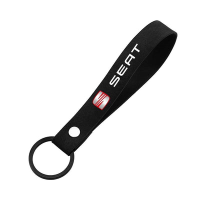 Porte-clés en sangle noire au logo Seat, fourni avec les bouchons de valve