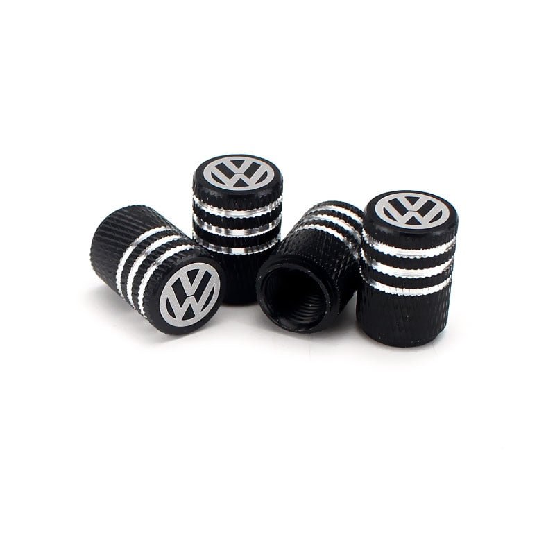bouchon de valve Volkswagen de couleur noir, avec logo Volkswagen inscrit sur le dessus.