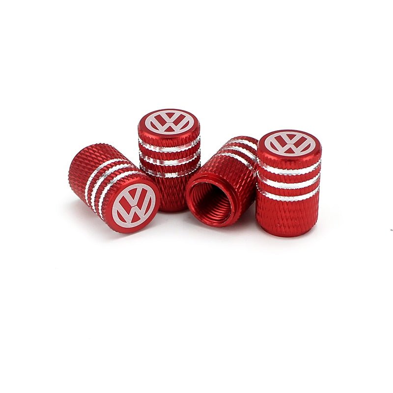 bouchon de valve Volkswagen de couleur rouge, avec logo Volkswagen inscrit sur le dessus.