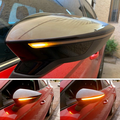 Clignotant dynamique Seat Leon 5F installé sur le rétroviseur d'une Leon rouge, LED orange en fonctionnement