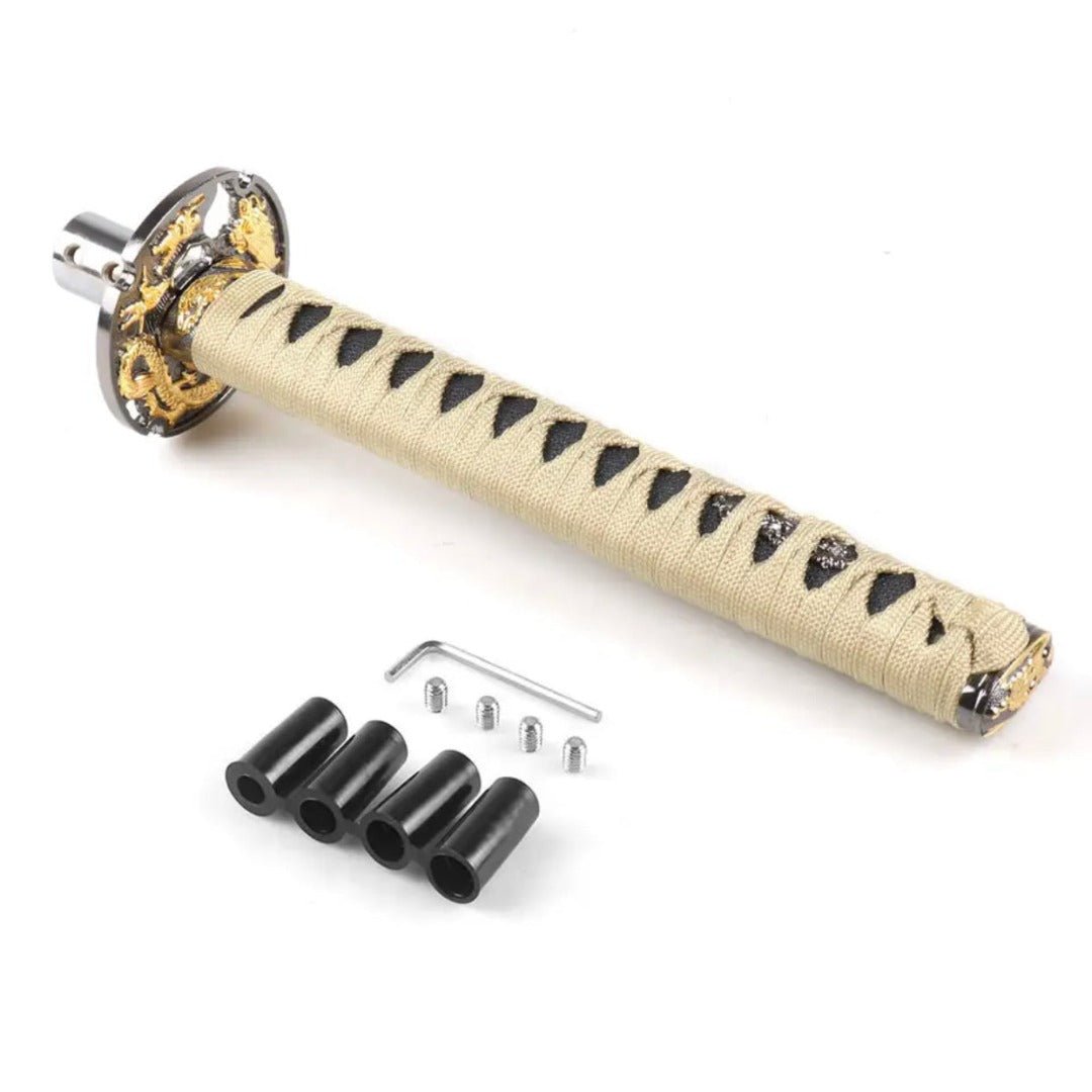 Pommeau de vitesse katana, de taille 26 cm, de couleur beige.