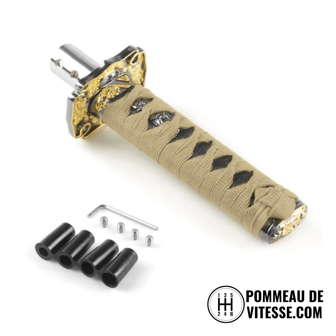 Pommeau de vitesse katana, de taille 15 cm, de couleur beige.