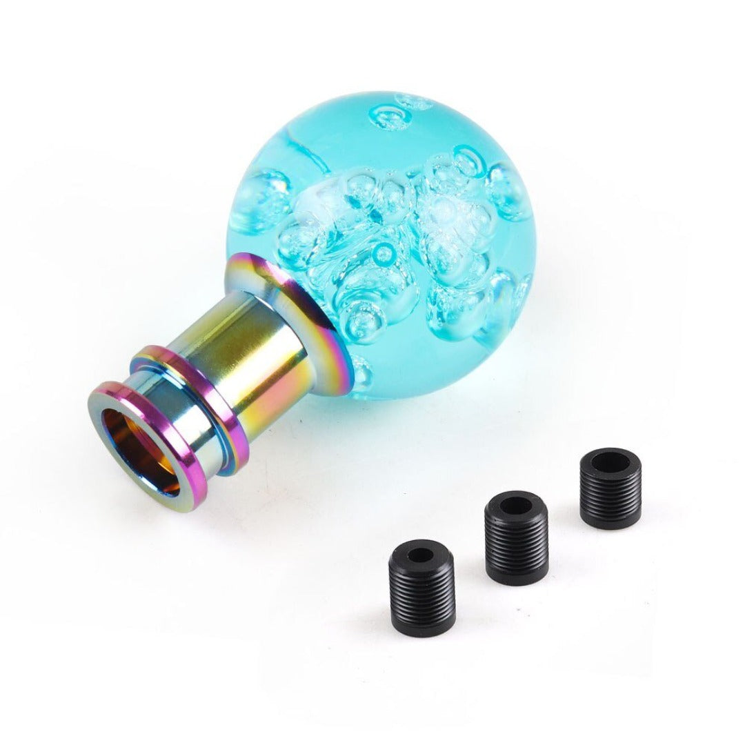 Pommeau de vitesse original en forme de boule, de couleur bleu cyan.