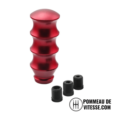 Pommeau de vitesse original M2, de forme cylindrique et de couleur rouge.