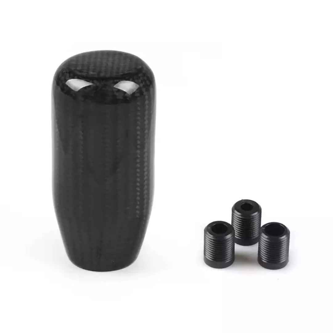 Pommeau de vitesse sport de forme cylindrique.